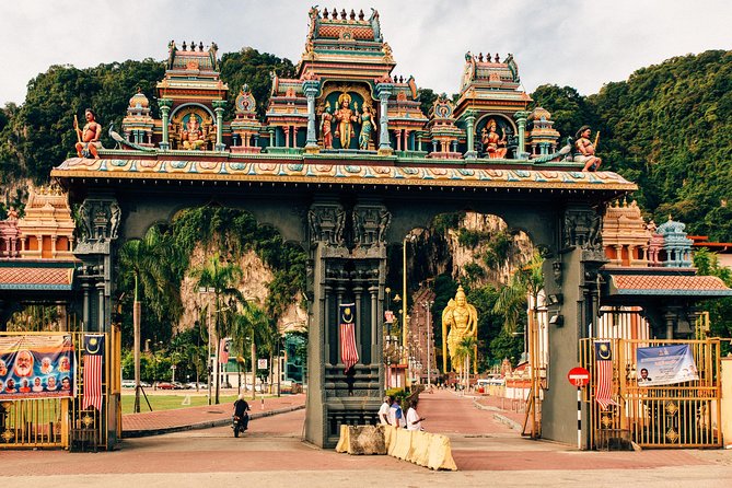 Batu Caves Private Tour with Pick-up from Kuala Lumpur - Climbing beneath the Lord Murugan Statue