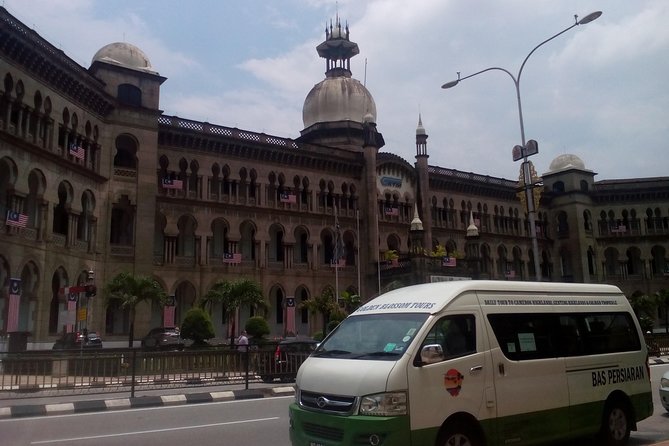 Wonders of Kuala Lumpur City & Countryside + Batu Caves (Private Guided Tour) - The Petronas Towers are a quick photo stop